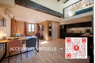 a living room with a dining table and a kitchen at 06A2 - Heart of Old Nice beautiful renovated apartment in Nice