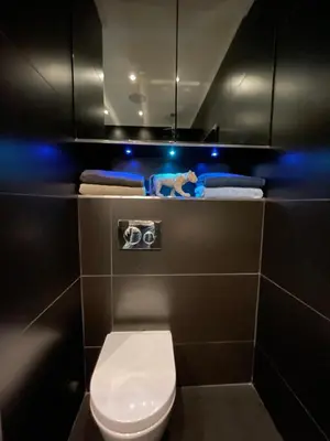 a bathroom with a toilet and a camera in it at SEA VIEW TOP FLOOR - PROMENADE DES ANGLAIS in Nice