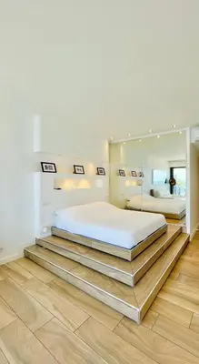 a bedroom with a large bed and a large mirror at SEA VIEW TOP FLOOR - PROMENADE DES ANGLAIS in Nice
