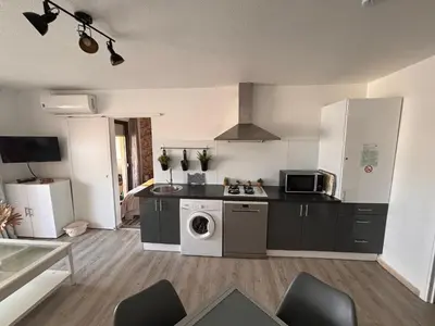 a kitchen with a stove and a microwave at Provencal in Cagnes-sur-Mer