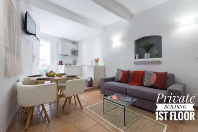a living room with a couch and a table at PRIVATE BUILDING, 4 APTS, UNIQUE AT NICE- OLD TOWN in Nice