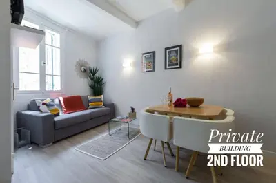 a living room with a couch and a table at PRIVATE BUILDING, 4 APTS, UNIQUE AT NICE- OLD TOWN in Nice
