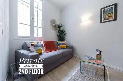 a living room with a couch and a table at PRIVATE BUILDING, 4 APTS, UNIQUE AT NICE- OLD TOWN in Nice