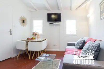 a living room with a couch and a table at PRIVATE BUILDING, 4 APTS, UNIQUE AT NICE- OLD TOWN in Nice