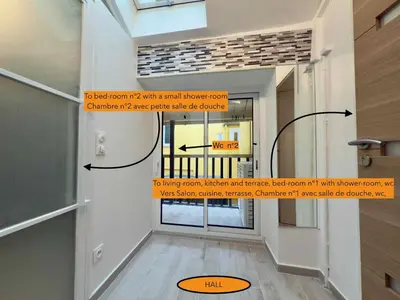 a view of a hallway with a door with a window at Ze Perfect Place - Opera Nice - Appartement 2 Chb - AC - Terrasse in Nice