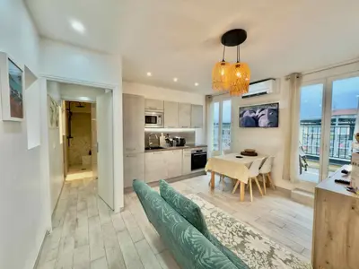 a living room with a couch and a table at Ze Perfect Place - Opera Nice - Appartement 2 Chb - AC - Terrasse in Nice