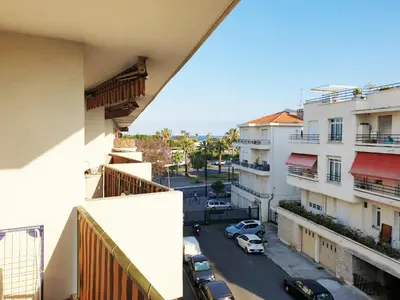 a view of a city street from a building at Beautiful T1 with sea view in Nice