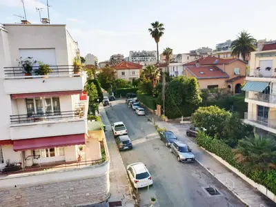 an aerial view of a city street with cars parked at Beautiful T1 with sea view in Nice