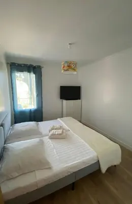 a bedroom with a bed with two towels on it at Villa Canarias in Saint-Jeannet