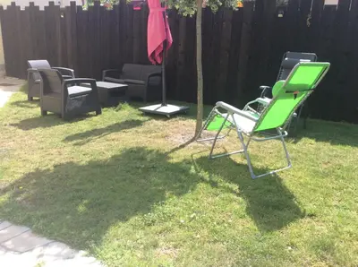 a group of lawn chairs sitting in a yard at Les palmiers in Nice