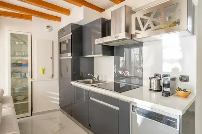 a kitchen with a sink and a counter top at Stunning Duplex place Masséna 2 mins walk from beaches in Nice