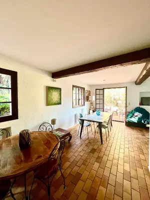 a living room with blue couches and a table at Entre Nice et Monaco grande Villa avec piscine privée 12 personnes in Drap