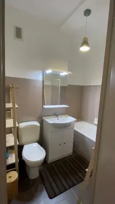 a bathroom with a toilet and a sink and a tub at Appartement entier. Nice Riquier in Nice