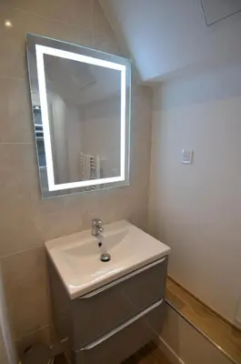 a bathroom with a sink and a mirror at NAPOLEON - Superbe appartement 2 chambres au cœur du Port de Nice in Nice