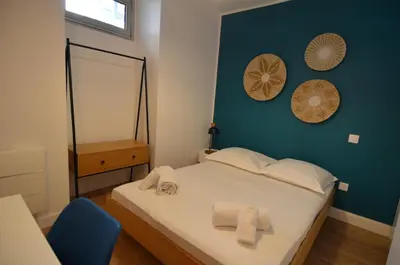 a bedroom with a bed with towels on it at NAPOLEON - Superbe appartement 2 chambres au cœur du Port de Nice in Nice