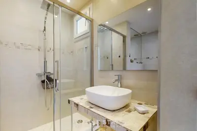 a bathroom with a sink and a shower at Suite Horizon FSHH in Beaulieu-sur-Mer