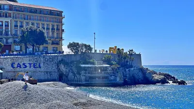 a boat is docked on a beach near the water at LE RIQUIER - Port Lympia à 10 mins à pied in Nice