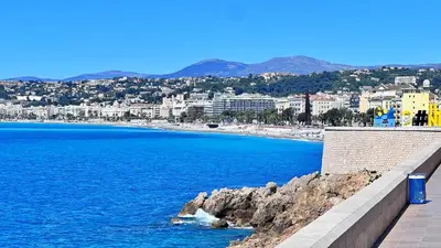 a view of a beach with buildings and the ocean at LE RIQUIER - Port Lympia à 10 mins à pied in Nice