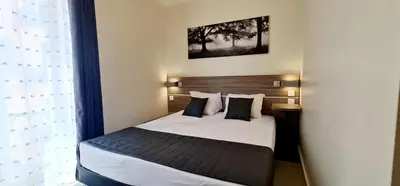 a bedroom with a bed in a room at ESPERANCE HOTEL in Nice