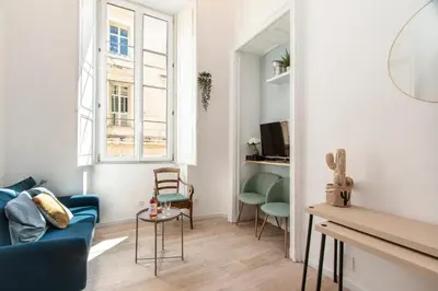 a living room with a blue couch and chairs at Maison Bianchi - Prefecture - Old Town in Nice