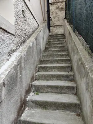 a set of concrete stairs next to a building at Loft Magnan - PARKING - idéal couples -BEACH -TRAM & Supermarkets - New & Confort-AC in Nice
