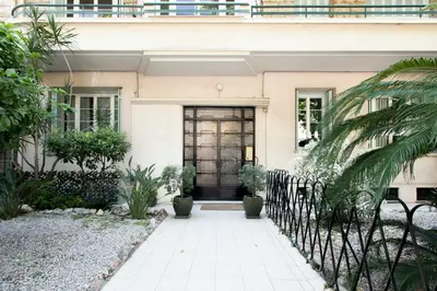 a house with a black door and a fence at Maison Bianchi - Victor Hugo in Nice
