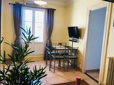 a room with a table and chairs and a television at 