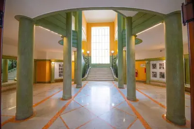 a hallway with columns in a building at Новая 3-комнатная квартира на 2й линии от моря. in Nice