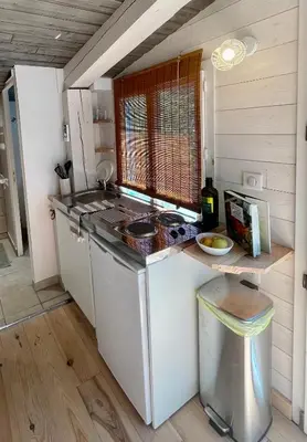 a kitchen with a stove and a counter top at Little California - Adorable Studio Indépendant in Cagnes-sur-Mer