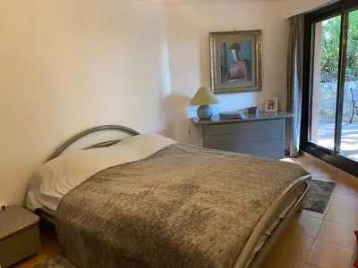 a bedroom with a bed and a window at Nice Absea Corniche Fleurie in Nice