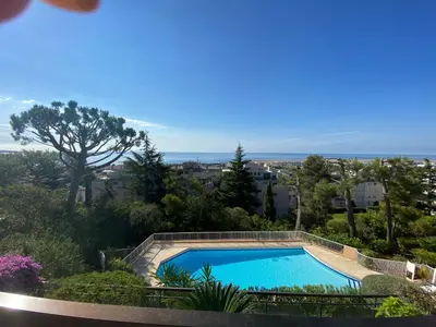 a swimming pool with a view of the ocean at Nice Absea Corniche Fleurie in Nice