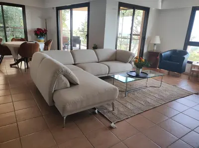 a living room with a couch and a table at Nice Absea Corniche Fleurie in Nice