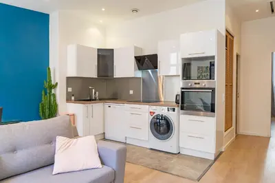 a kitchen with a washing machine and a washer at Nice: hyper centre !Super appartement cosy in Nice
