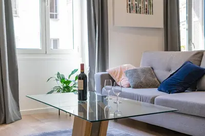a living room with a couch and a glass table at Nice: hyper centre !Super appartement cosy in Nice