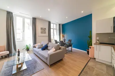 a living room with a couch and a table at Nice: hyper centre !Super appartement cosy in Nice