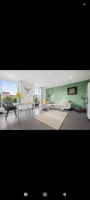 a living room with a couch and a table at Super appartement au cœur de Nice! Bonnes vacances in Nice