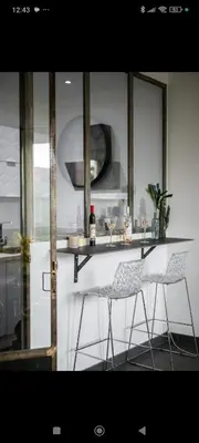 two chairs sitting at a bar in a kitchen at Super appartement au cœur de Nice! Bonnes vacances in Nice
