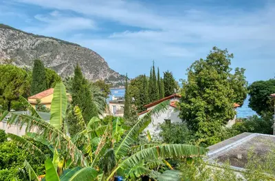 a view of the amalfi coast with trees and houses at Deluxe VILLA GRAZIELLA 200 M FROM THE BEACH in Èze
