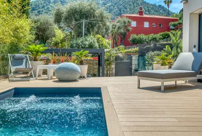 a backyard with a swimming pool and a house at Deluxe VILLA GRAZIELLA 200 M FROM THE BEACH in Èze