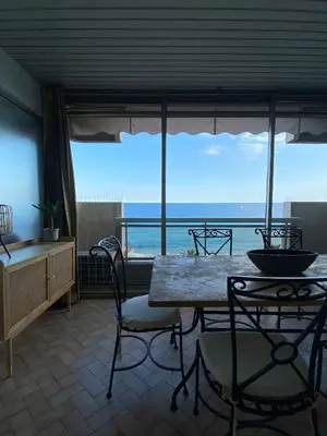 a dining room with a view of the ocean at LE BAHIA in Nice
