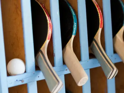 a bunch of tennis rackets hanging in a rack at Le Val Duchesse Hotel & Appartements in Cagnes-sur-Mer