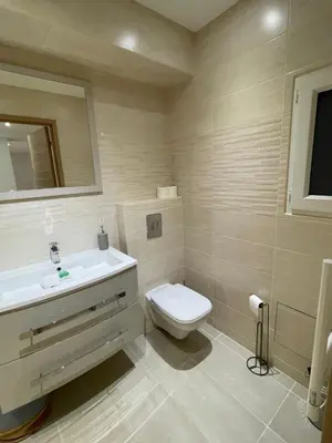 a kitchen with a sink and a washing machine at 
