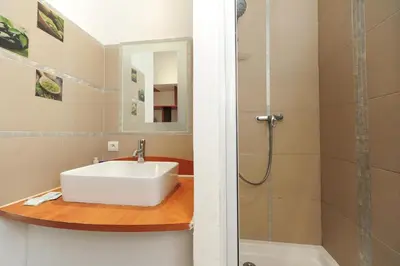 a bathroom with a sink and a shower at PV STUDIO Five Stars Holiday House in Nice
