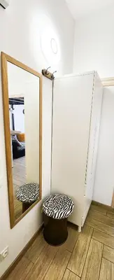 a mirror and a stool in front of a mirror at STUDIO- NICE MONT BORON, PISCINE SUR LA RESIDENCE in Nice