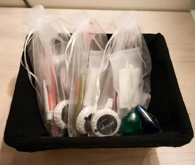 a black box filled with toothbrushes and other items at STUDIO- NICE MONT BORON, PISCINE SUR LA RESIDENCE in Nice