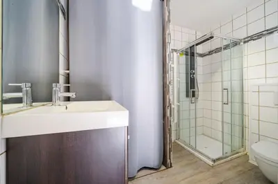 a bathroom with a sink and a shower at Charmant studio in Cagnes-sur-Mer