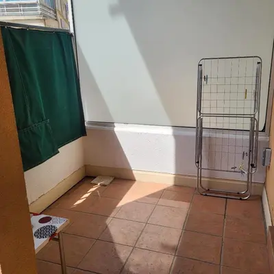 a bathroom with a shower and a tiled floor at Cœur d'azur in Saint-Laurent-du-Var
