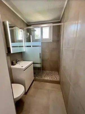 a bathroom with a shower and a toilet and a sink at Nice Apartement 20 mins from the beach in Nice