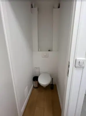 a small white bathroom with a toilet in a room at Nice Apartement 20 mins from the beach in Nice