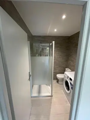 a bathroom with a shower and a toilet in it at Studio en bas de villa avec piscine proche bord de mer in Cagnes-sur-Mer